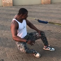 A man pulls a truck using his teeth