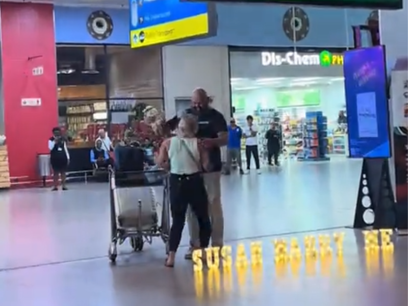 A man sets up a proposal at the King Shaka Airport