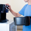 A man using an air fryer