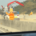 A mechanical flag person waving a flag on N2 freeway
