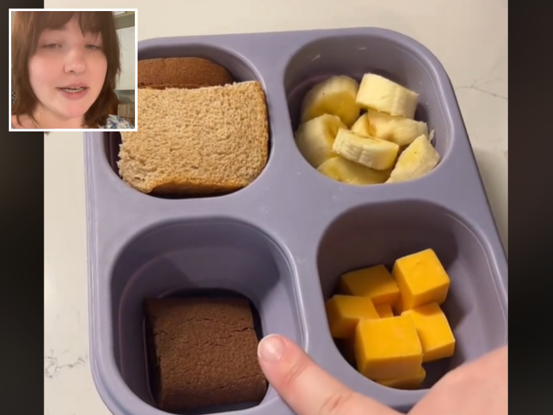 A packed lunchbox with cheese and sandwiches