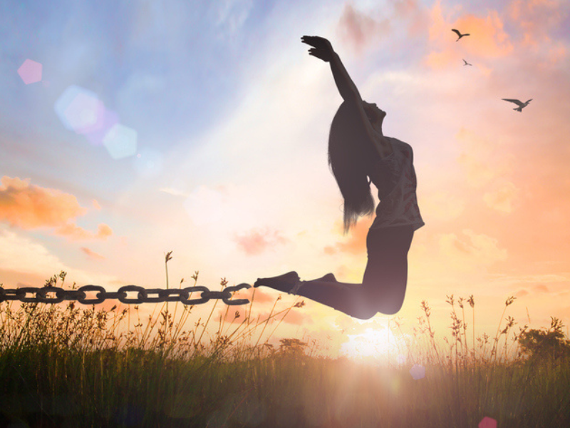 A person leaping away from a chain