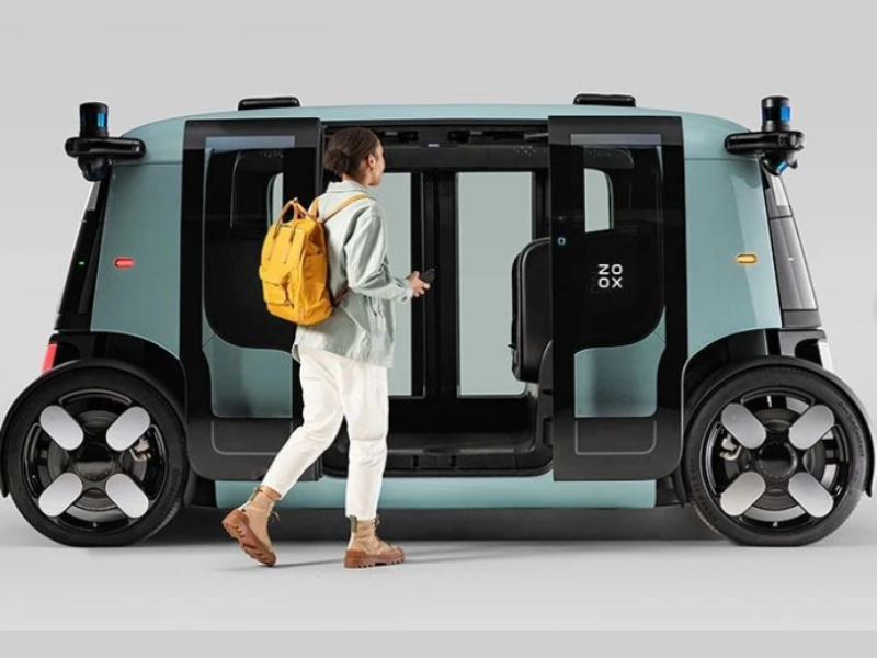 A person walking into the robotaxi