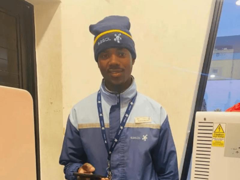 A petrol attendant wearing his Sasol uniform