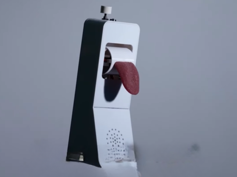 A phone receiver with a silicone tongue attachment on it