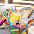 A photo of a shopping cart filled with stationery