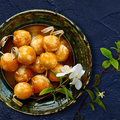 Close up picture of a place filled with sweet rice balls