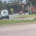 A police van tries to get an Uber Eats delivery driver to stop his bike