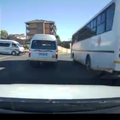 A security dash cam video shows bus overtake a taxi on oncoming lane
