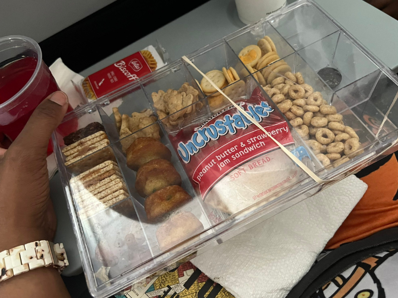 A snack box with different foods inside