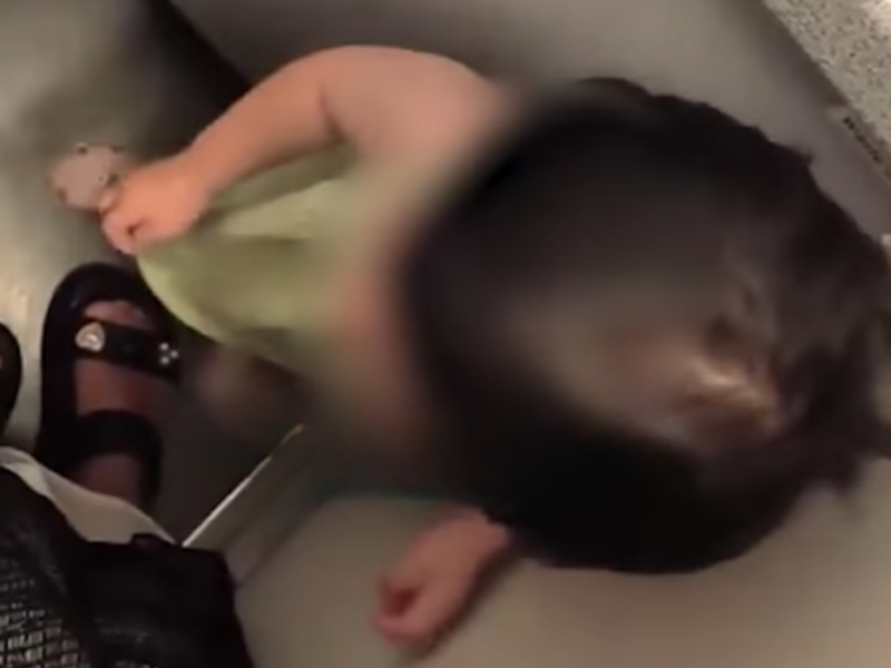 A toddler is locked inside an airplane toilet