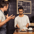A waiter and customer having a heated discussion