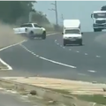 A white bakkie swerves on the freeway trying to avoid other vehicles