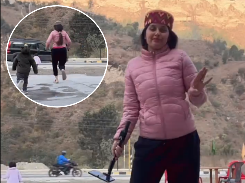 A woman dancing for a reel does not notice her baby walking to the roadway