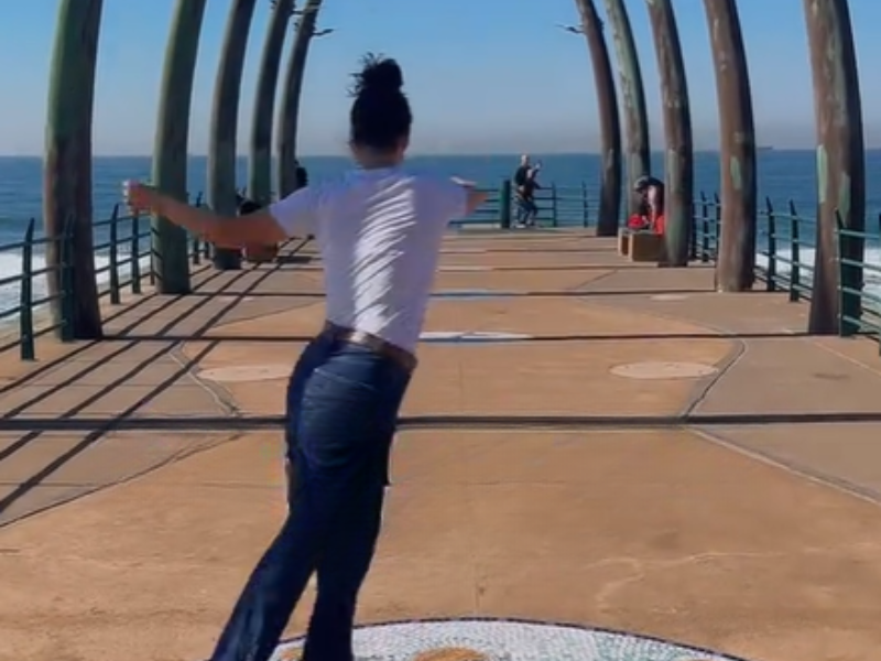 A woman does a salsa move at the Umhlanga Whalebone pier