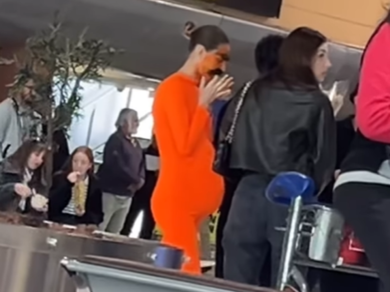 A woman dressed like the Lorax standing in Cape Town International