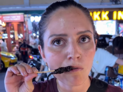 A South African woman describes the taste of scorpion in Bangkok