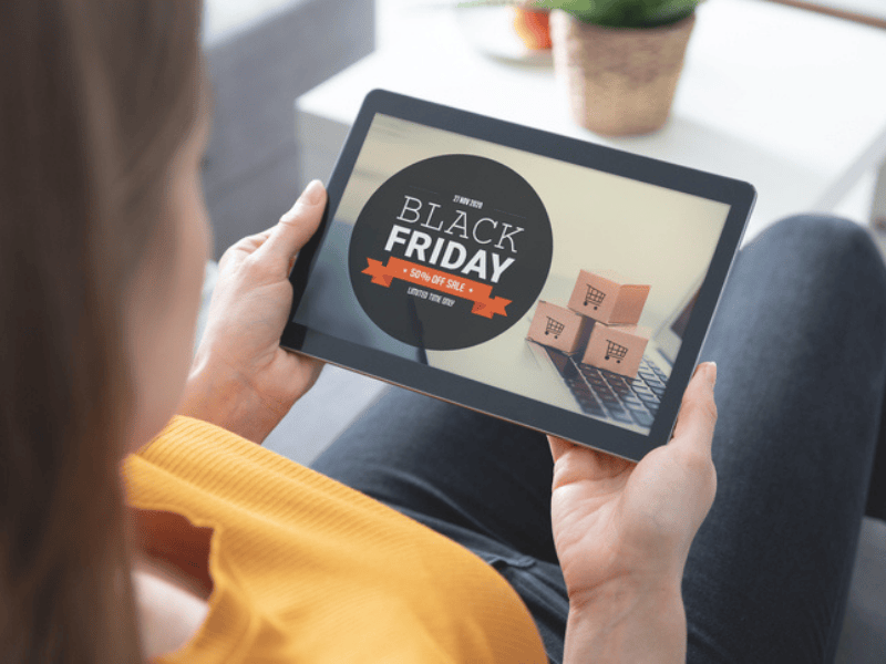 A woman shopping online for a Black Friday sale