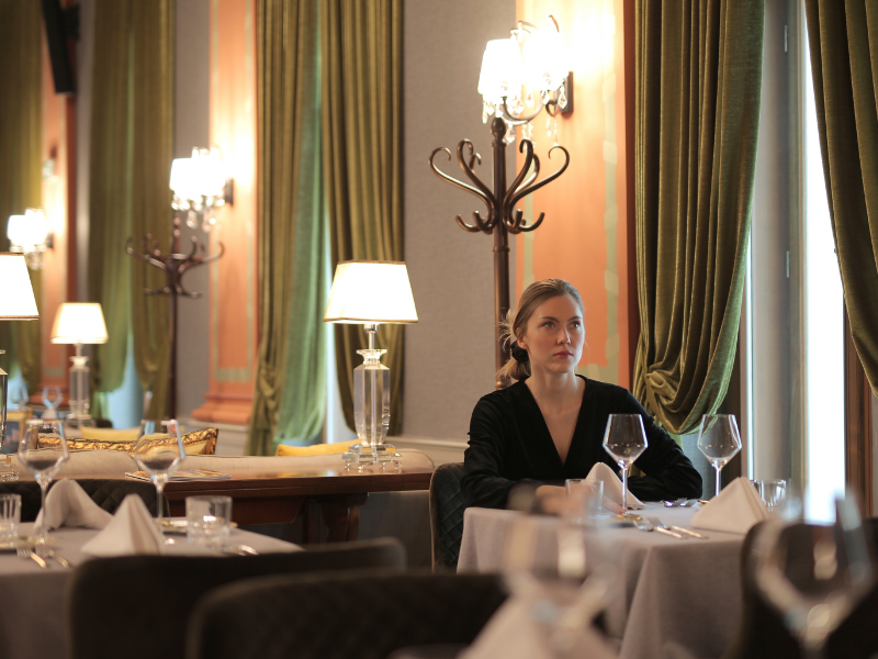 A woman sitting at restaurant waiting for someone