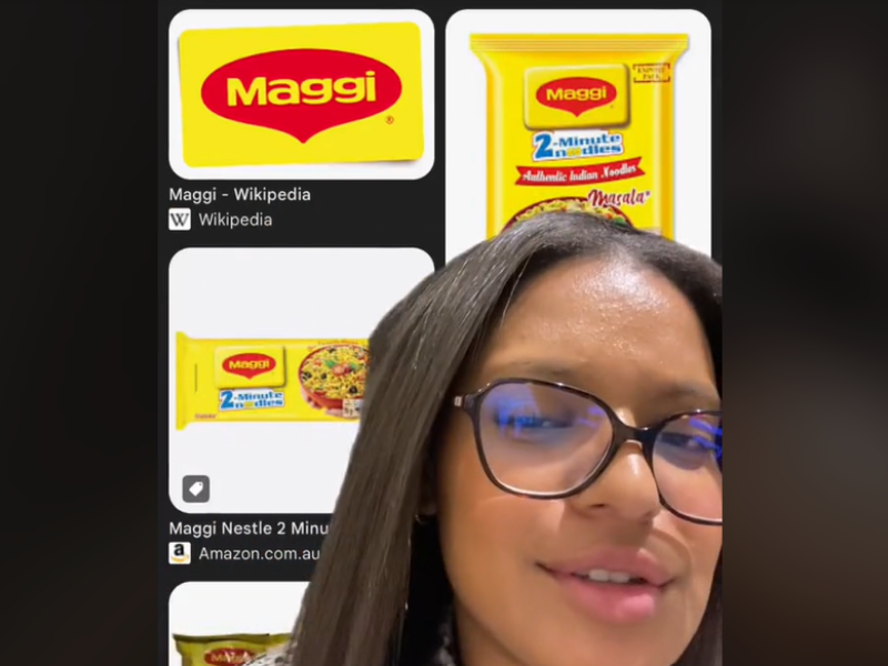 A woman using a green screen with Maggi noodles products