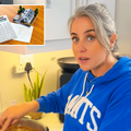 A woman wearing a blue hoodie cooking