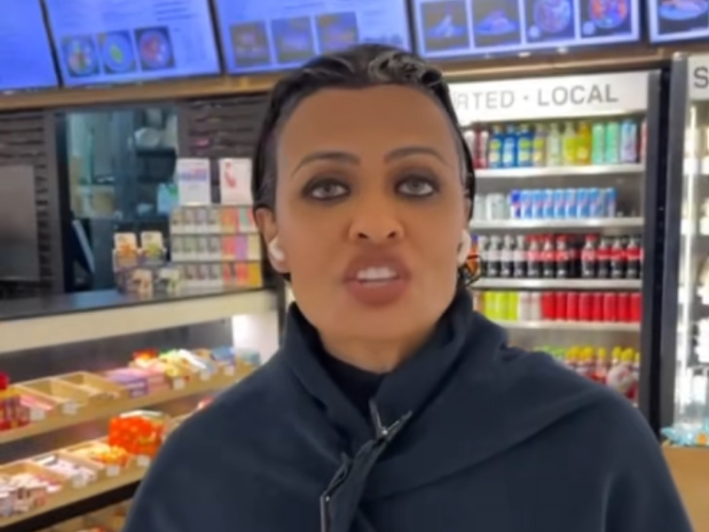 A woman with dye on her hair walking around the mall