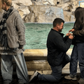 A womans pants are pinned down as a man proposes in Rome