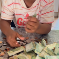 A young child is happy with her savings