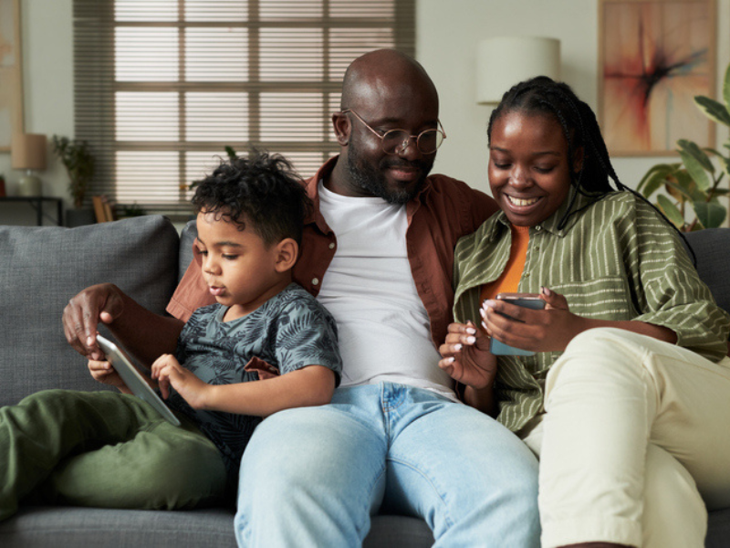 A young family using mobile gadgets