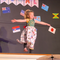 A young girl performing at her school concert