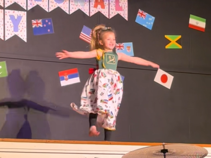 A young girl performing at her school concert