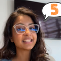 A young woman wearing spectacles sharing some tips