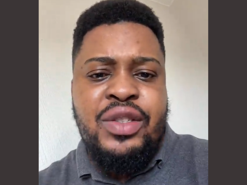 African father with a beard looks distressed