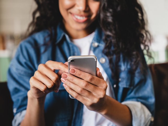African-American young woman using smart phone