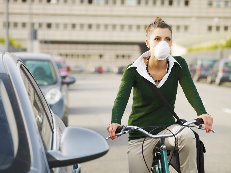 Female commuter wearing mask