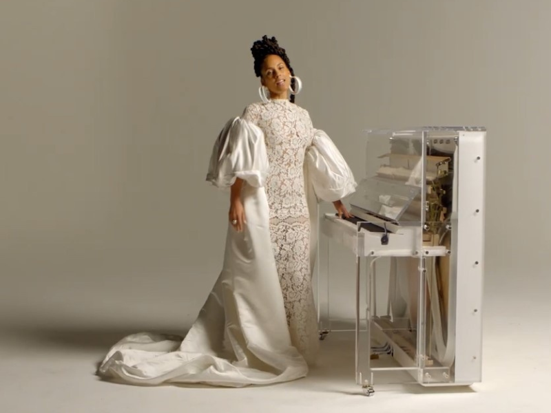 Alicia Keys wearing a white dress