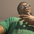 An African American man wearing glasses