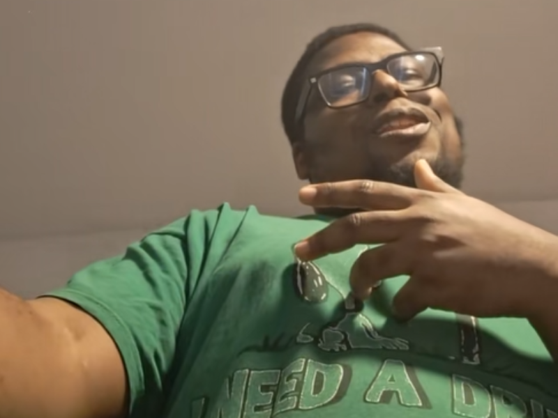 An African American man wearing glasses
