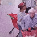 An elderly man gets distracted by a woman trying to grab his car keys