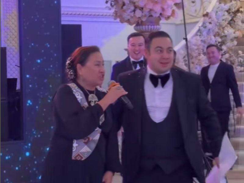 An elderly woman singing on a microphone leaving people shocked