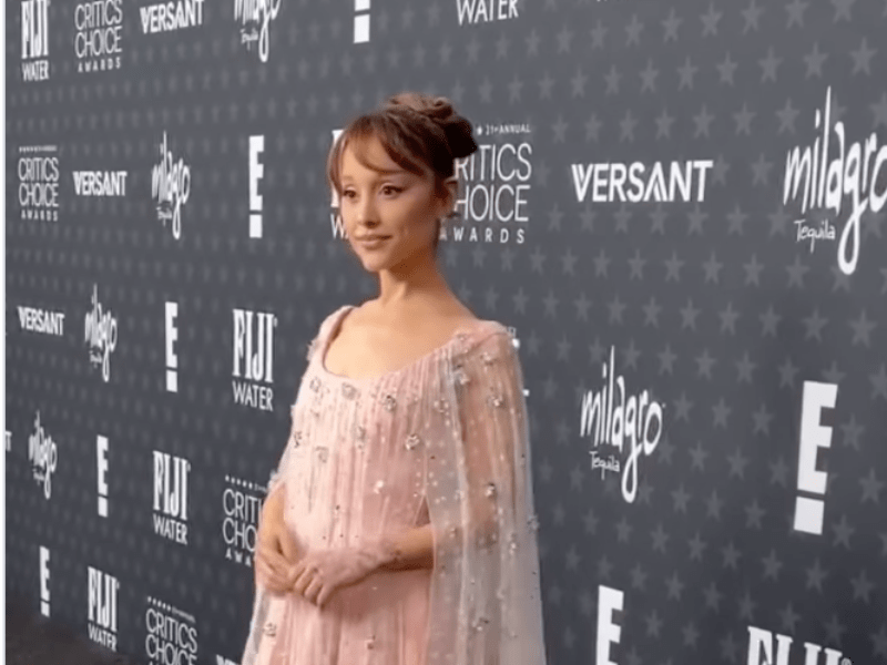 Ariana Grande wearing a blush pink dress