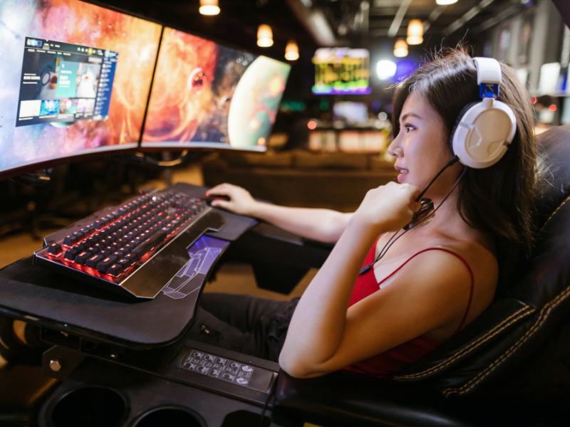 Asian woman playing video games