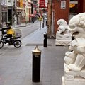 A food delivery rider rides down a street in Melbourne's Chinatown