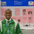 Azola Sihlahla stands at his booth at the Eskom science fair