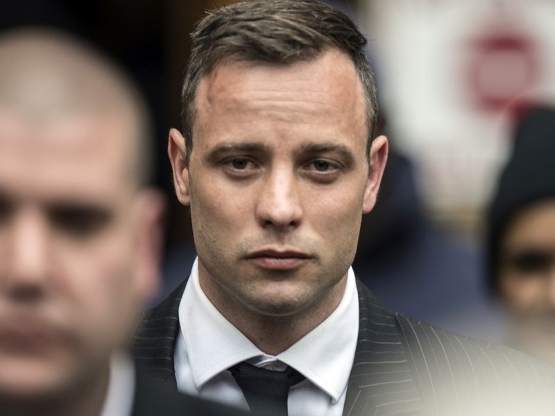 South African Paralympian Oscar Pistorius leaves the Pretoria High Court
