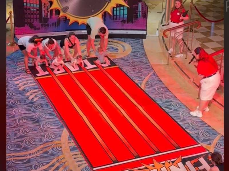 Babies line up for a crawling competition