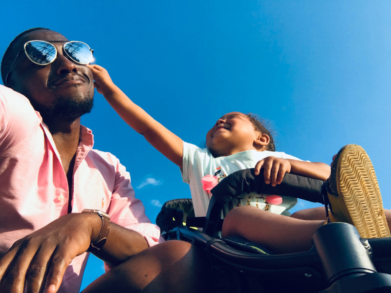 Baby playing with her father