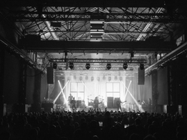 Band live in concert on stage in Scotland