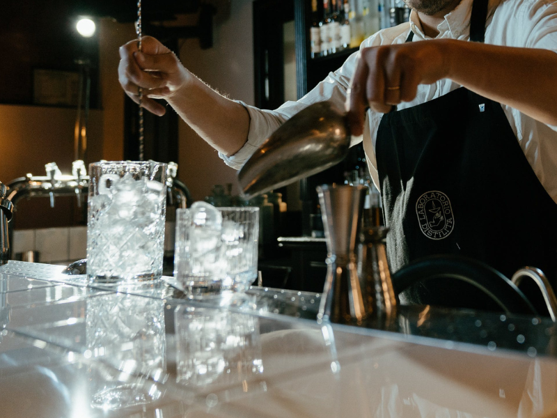 Bartender preparing drinks at a bar