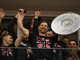 Bayer Leverkusen's Spanish head coach Xabi Alonso with Bundesliga trophy